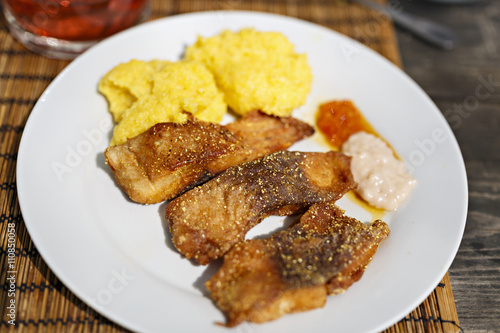 fried fish with polenta and garlic sauce
