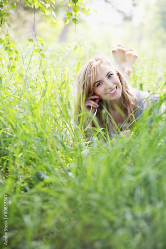 girl lying in the grass