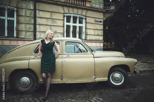 stylish woman standing on the background of your car © andriychuk