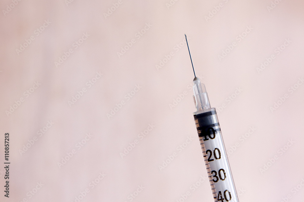 Syringe on wooden table Syringe on wooden table