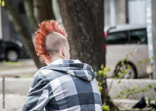 Punk with an original red hairdress.