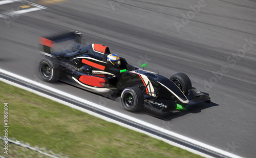 Formula 2 race car on a speed track with motion blur
