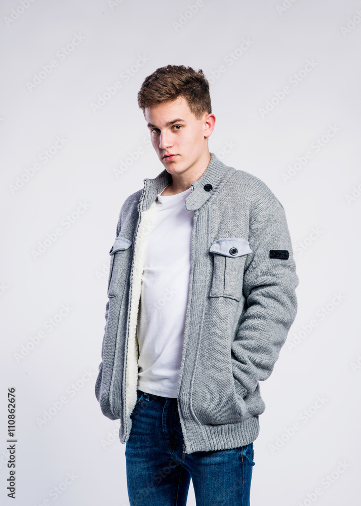 Boy in jeans and jacket, young man, studio shot Boy in jeans and jacket, young man, studio shot