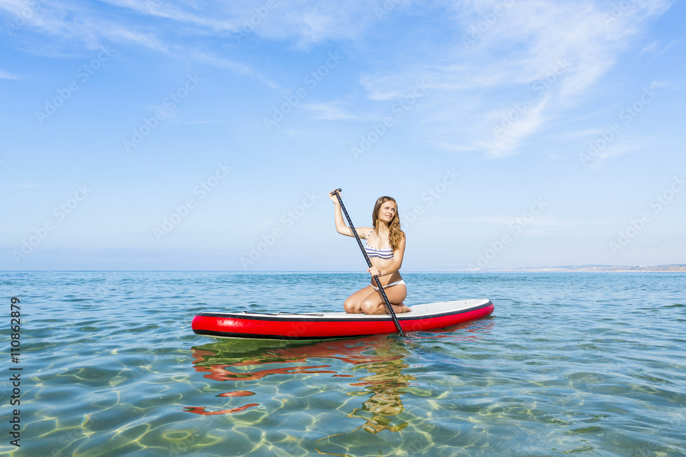 Fototapeta premium Woman practicing paddle