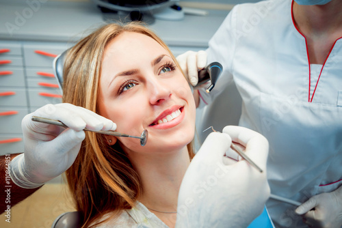 Young smiled woman at the dental office