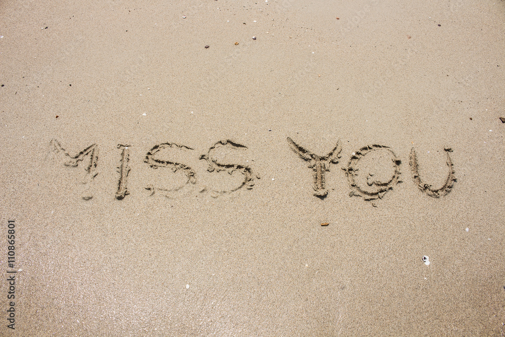 Fototapeta premium miss you on sand, picture concept and idea