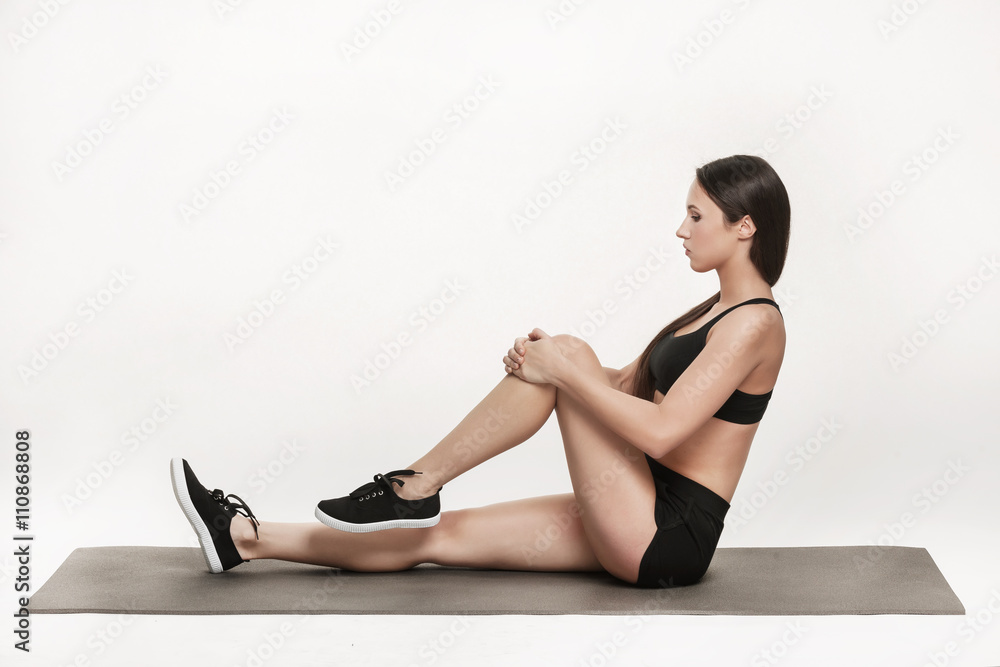 Woman exercising on mat Woman exercising on mat