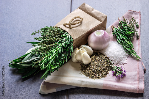 Spices: rosemary, thyme, oregano, sea salt, garlic and onion photo