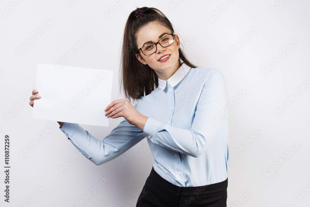 Smiling businesswoman girl presenting information on white card Smiling businesswoman girl presenting information on white card