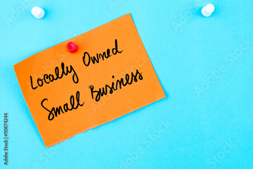 Locally Owned Small Business written on orange paper note