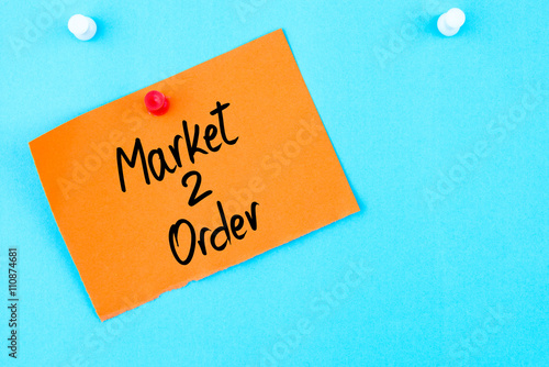 Market To Order written on orange paper note