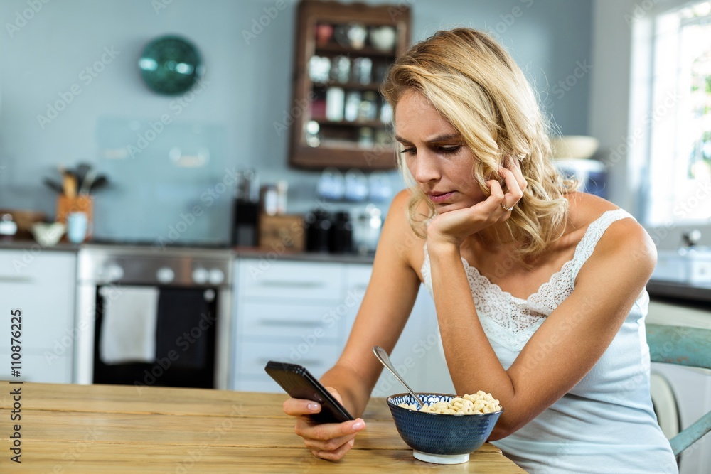 Woman using mobile phone at home Woman using mobile phone at home