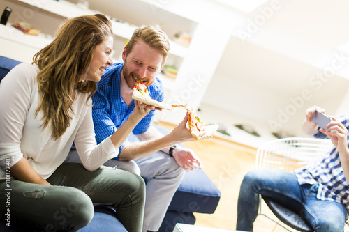 Couple eating pizza