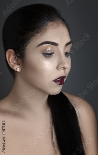 Close up beauty shot of a model with glowing makeup.