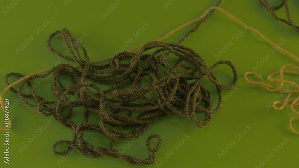 Yarn Green and Yellow Threads of Wool on Green Screen Moving and Unraveling Pieces of Threads Someone is Pulling the Thread Away Putting the Thread Away Yarn Green and Yellow Threads of Wool on Green Screen Moving and Unraveling Pieces of Threads Someone is Pulling the Thread Away Putting the Thread Away