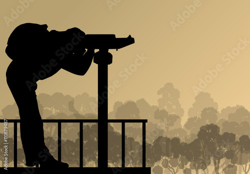 Tourist man looking through coin operated binoculars tower view