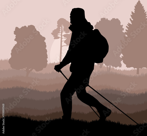 Man hiking in mountains adventure nordic walking with poles in n