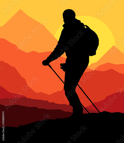 Man hiking in mountains adventure nordic walking with poles in n