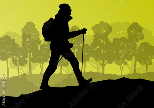 Man hiking in mountains adventure nordic walking with poles in n