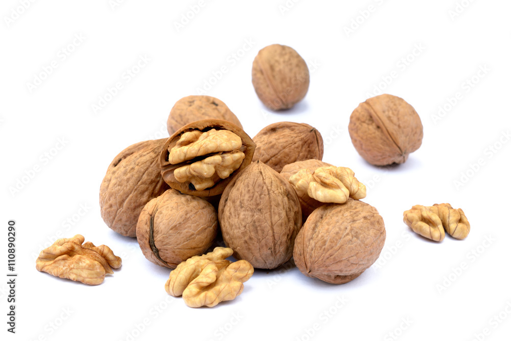 Fresh walnut with a shell isolated on white background Fresh walnut with a shell isolated on white background