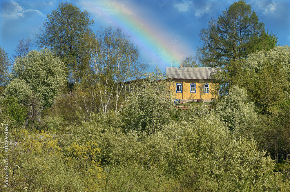 Rural spring landscape with rainbow after a storm. Rural spring landscape with rainbow after a storm.