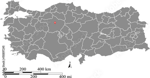 Turkey map vector outline with scales of miles and kilometers and capital location, Ankara, in gray background photo