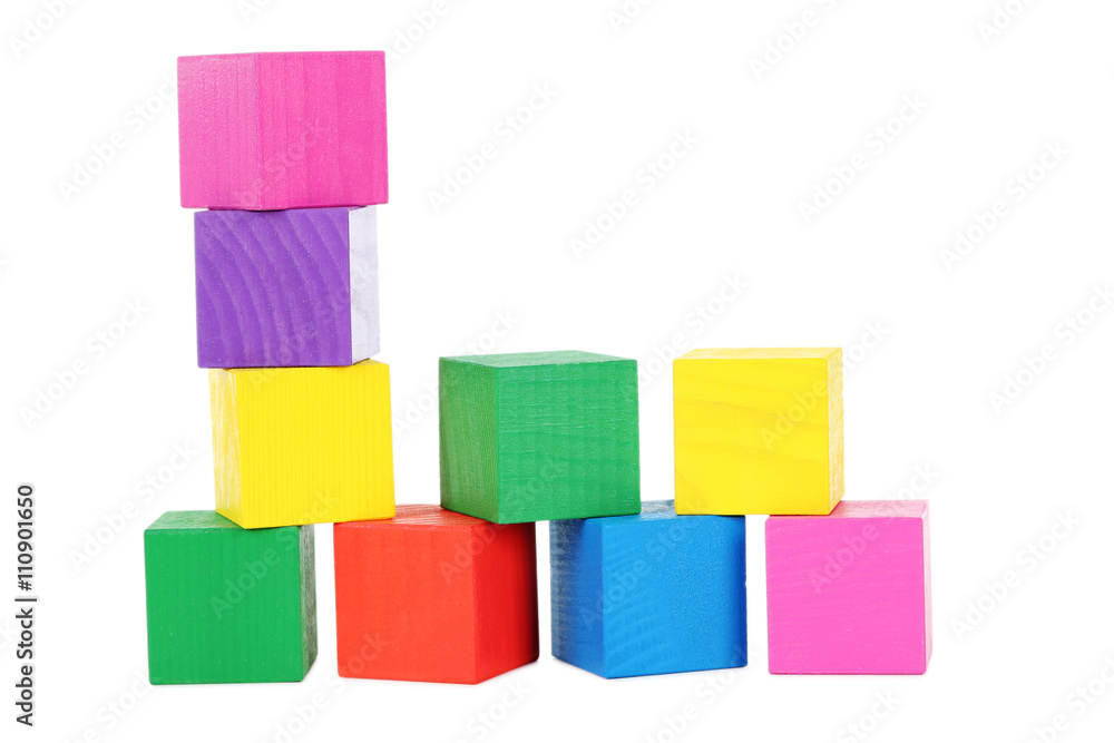 Colorful wooden toy cubes isolated on a white Colorful wooden toy cubes isolated on a white