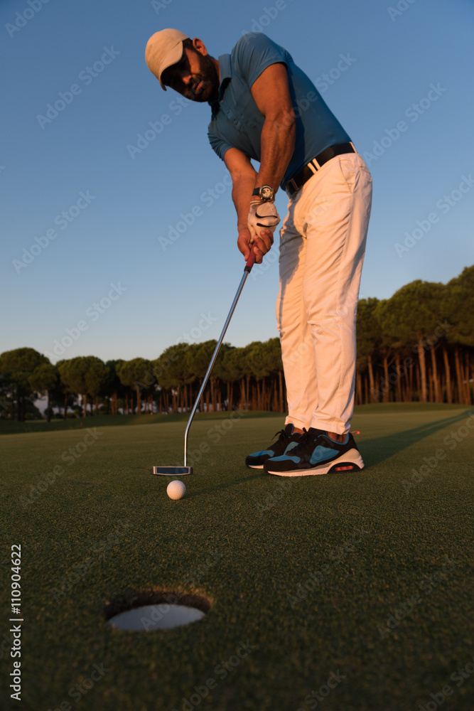 Fototapeta premium golfer hitting shot at golf course