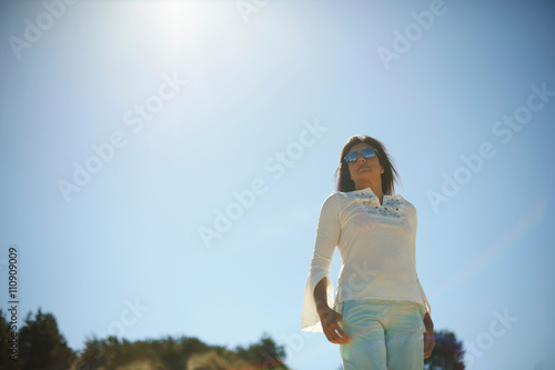 Woman under hot sun photo