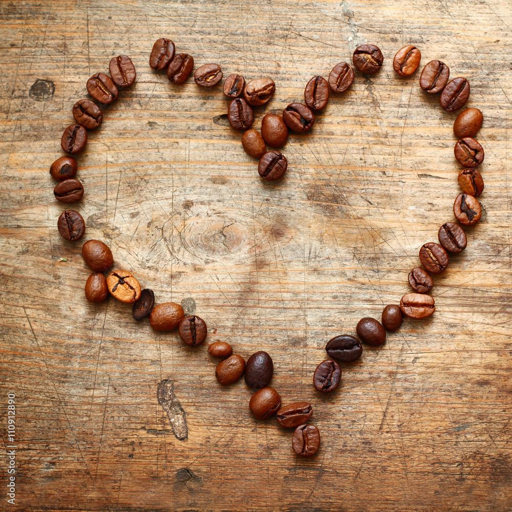 Coffe heart on old wooden background Coffe heart on old wooden background