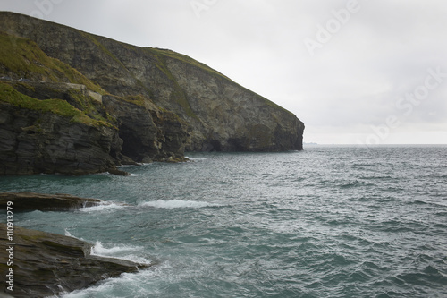 View of rocky cliffs and sea, Treknow, Cornwall, UK photo