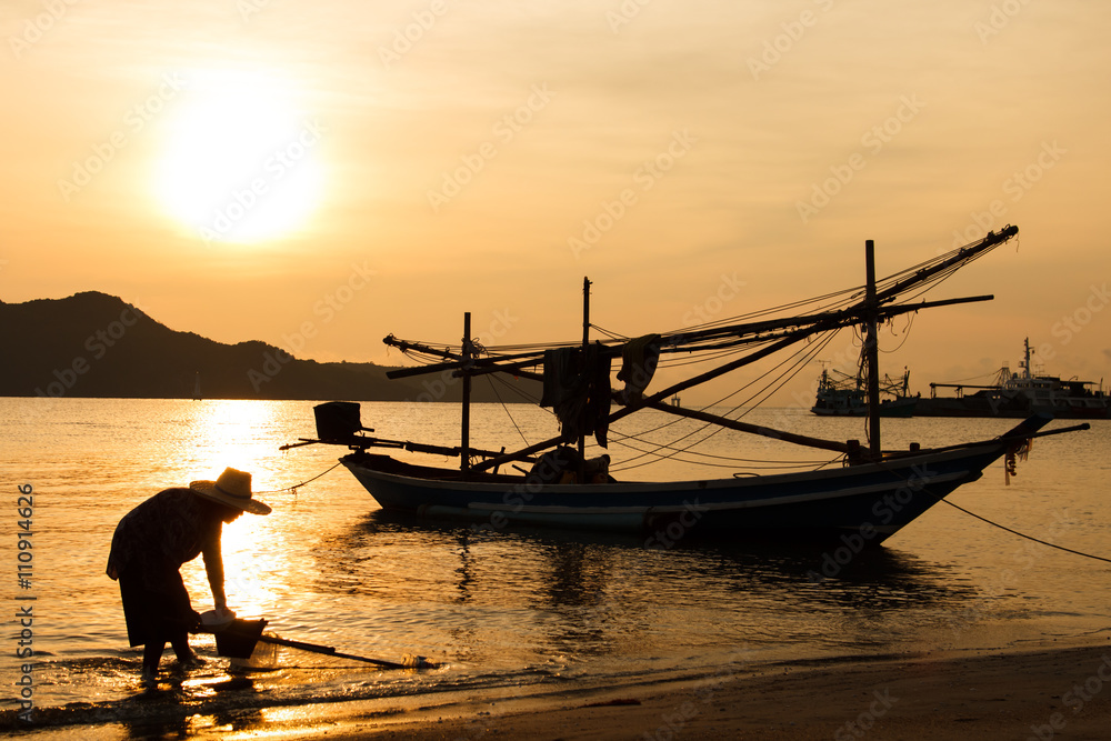 Fisherman working and sunrise