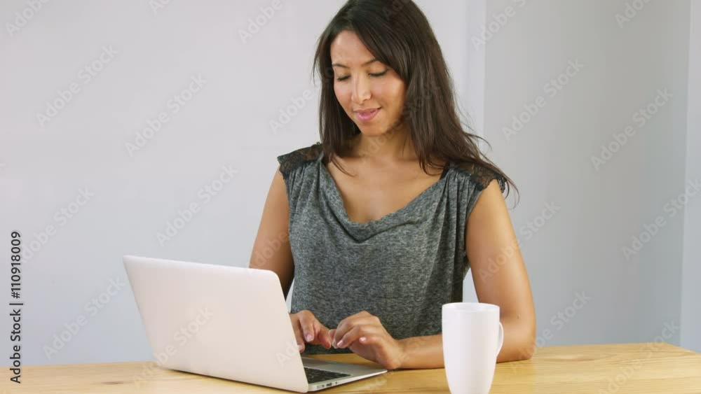 arabic woman using laptop computer in living room confident smiling arabic woman using laptop computer in living room confident smiling