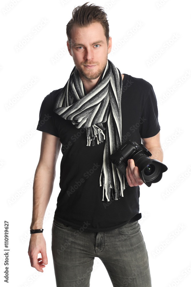 Attractive photographer with a digital slr camera, wearing a black tshirt, scarf and jeans. Standing against a white background.