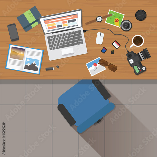 Top view of photographer working desk with stuff and laptop