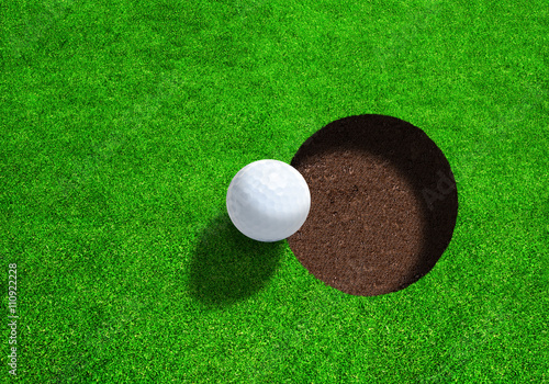 Golf Ball On Edge of Hole With Copy Space. View From Directly Above.