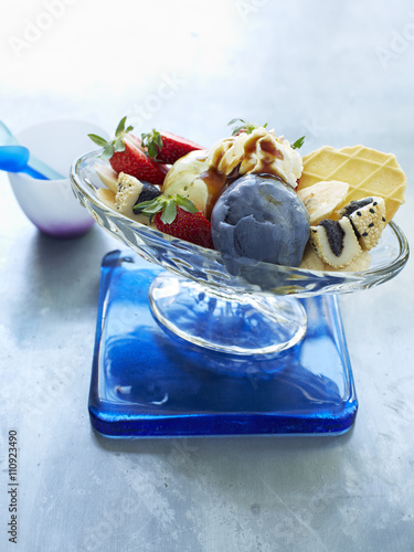 Still life with bowl of ice cream sundae photo