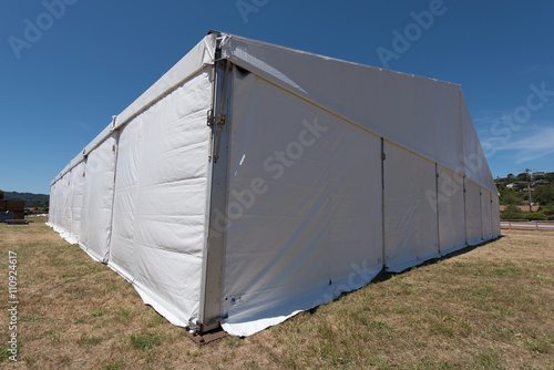 Large white tent for entertaining in field © Frank Fennema
