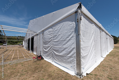 Large white tent for entertaining in field © Frank Fennema