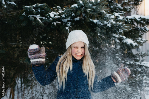 Girl grinning with excitement at snow