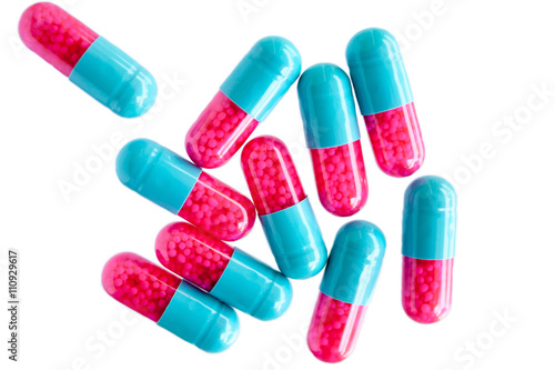 colorful pills isolated on white background photo