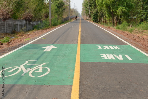 White bike symbol and arrow symbol on the bicycle lane, Countryside Korat - Thailand