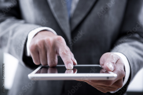 Young businessman working with modern devices, digital tablet co