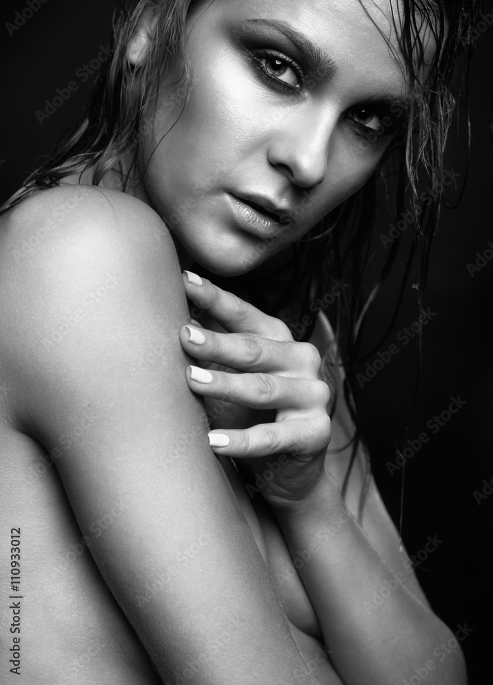 Woman with wet shining makeup on black background Woman with wet shining makeup on black background