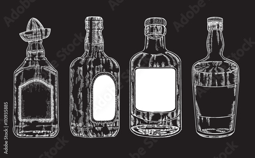 Vector bottles with strong alcohol. Hand drawn whiskey 