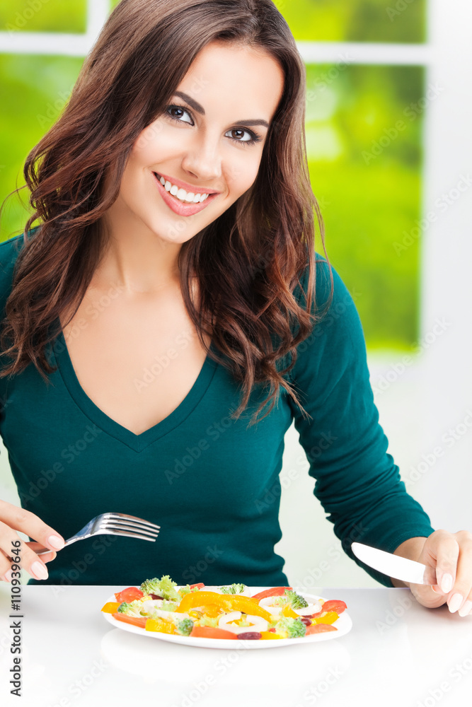 brunette woman with vegetarian vegetable salad brunette woman with vegetarian vegetable salad