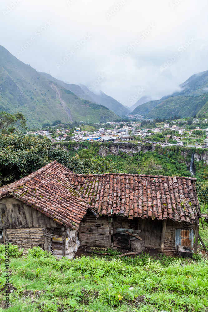 Old house and Banos de Agua Santa town in the background, popular tourist destination in Ecuador Old house and Banos de Agua Santa town in the background, popular tourist destination in Ecuador