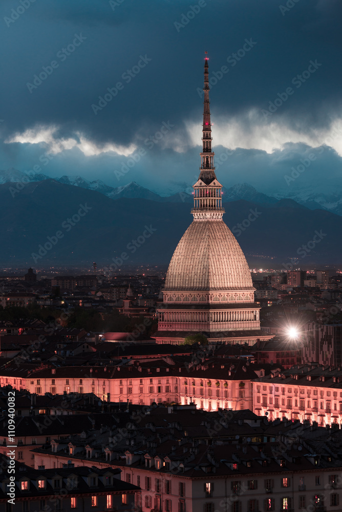 Glowing cityscape of Torino (Turin, Italy) at dusk, toned image