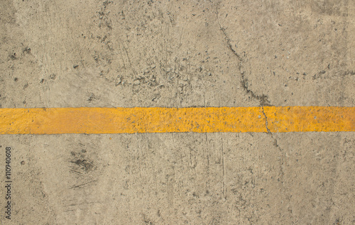 yellow line on the cement floor