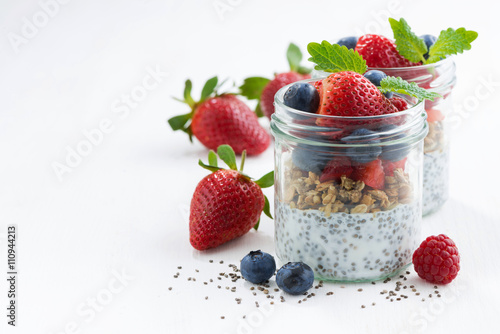 Breakfast in a jar, chia with berries and oat flakes 